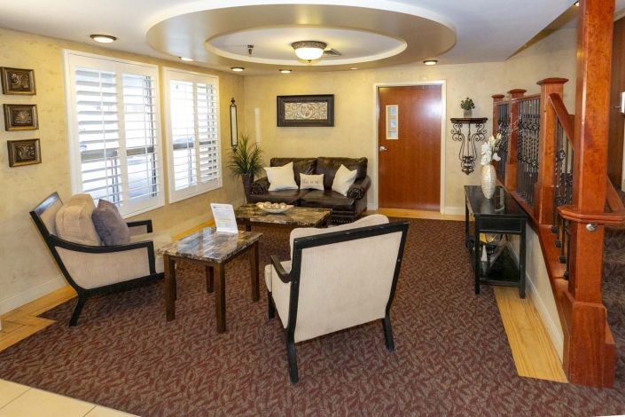 A cozy living room with comfortable seating and elegant decor.