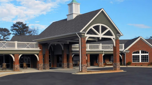 A beautifully designed entrance of a building with distinctive architectural features.