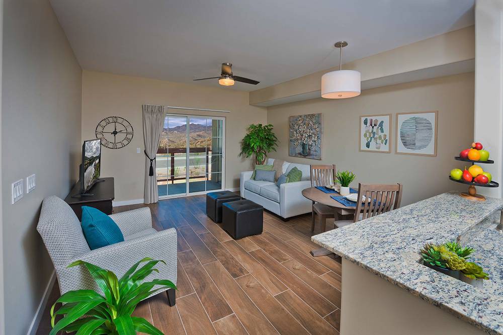 A modern living room featuring stylish decor and an open layout.