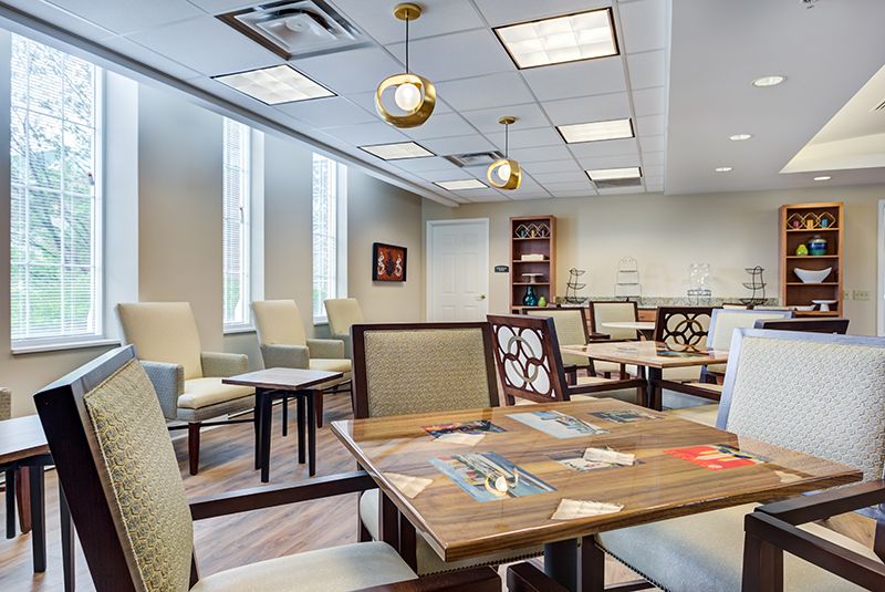 A modern waiting room with comfortable seating and contemporary lighting.