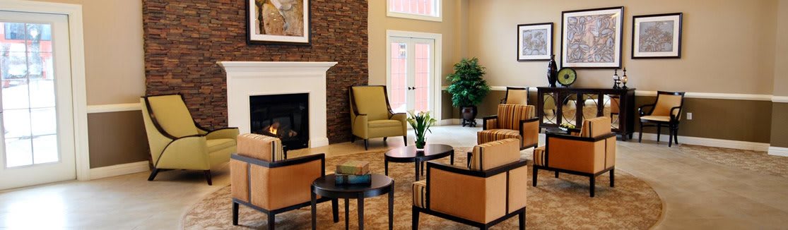 A cozy living room with comfortable seating, a fireplace, and stylish decor.
