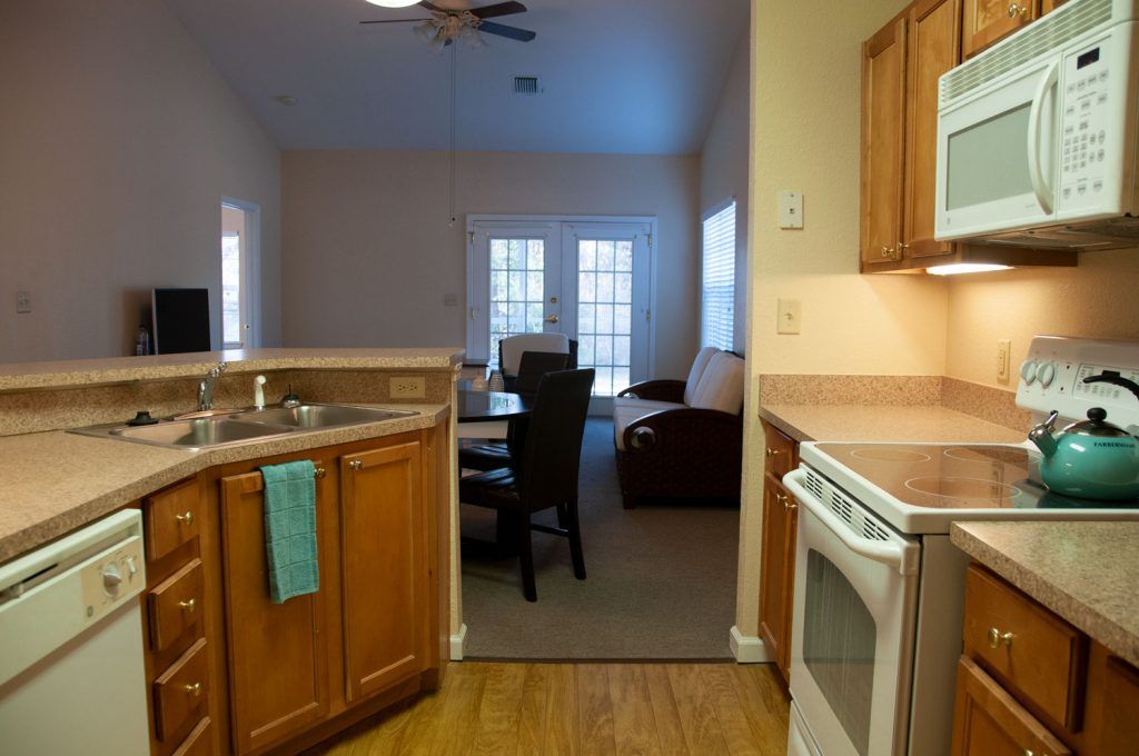 A cozy open-plan kitchen and living area in an apartment.