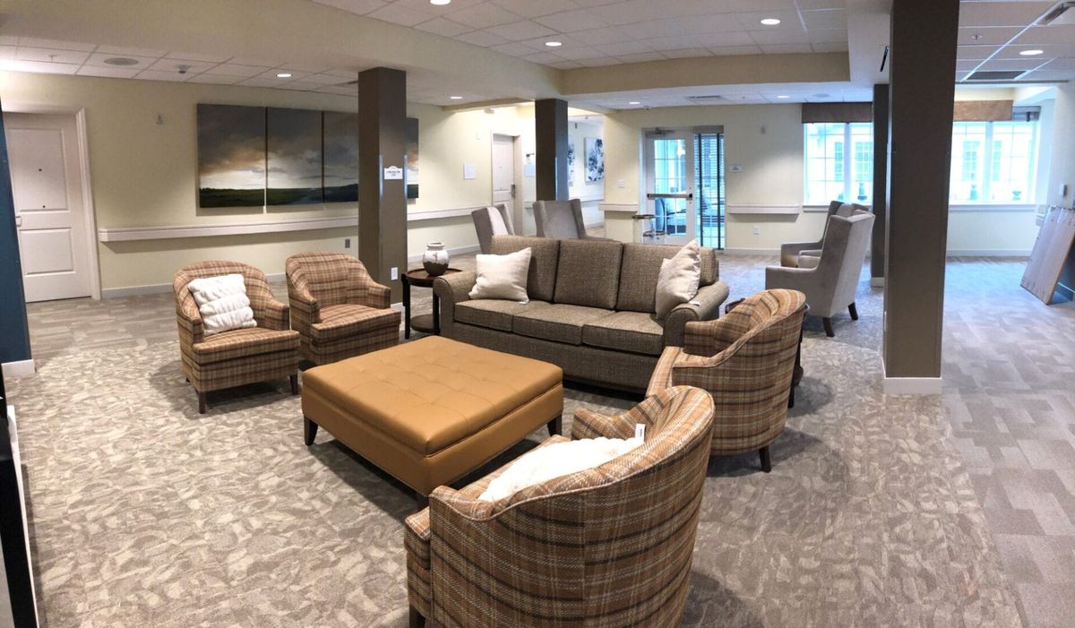 A cozy living room with modern furniture and neutral tones.