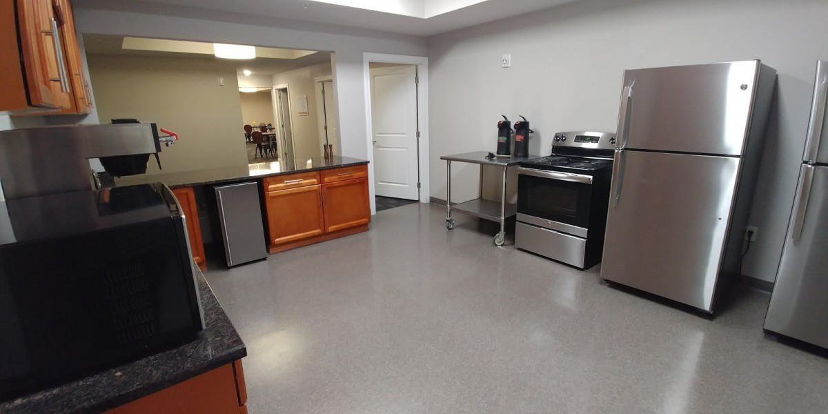A modern kitchen with stainless steel appliances and spacious countertops.