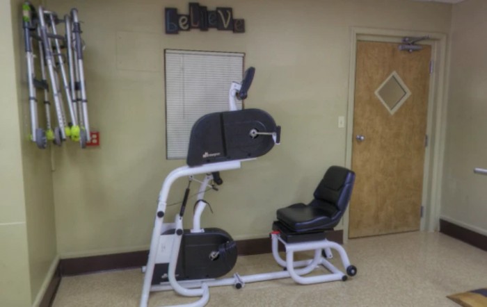 Seated exercise machine in a fitness room.