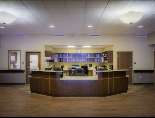 A modern reception area with stylish furniture and warm lighting.