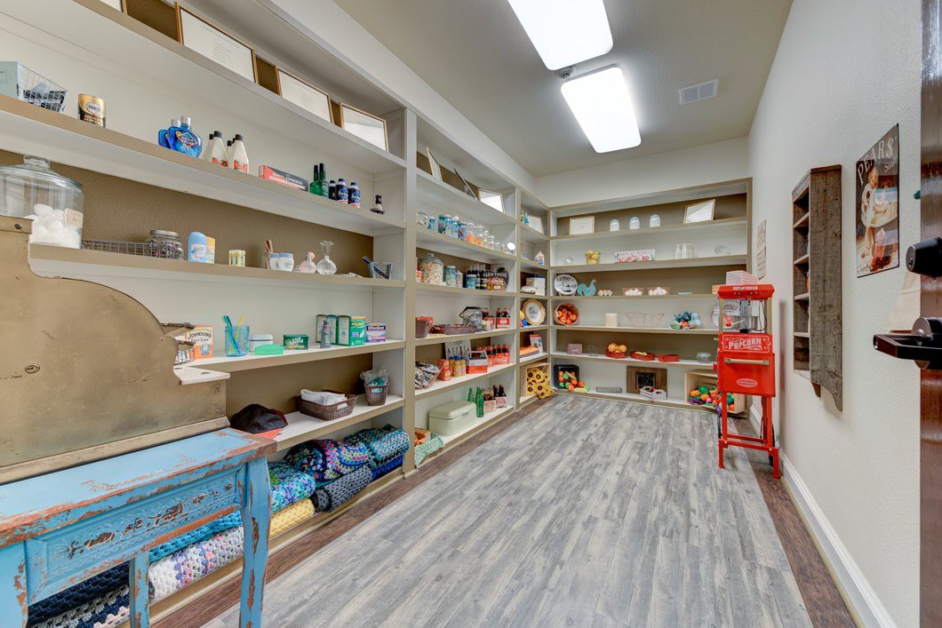 A well-organized storage room with shelves filled with various supplies.