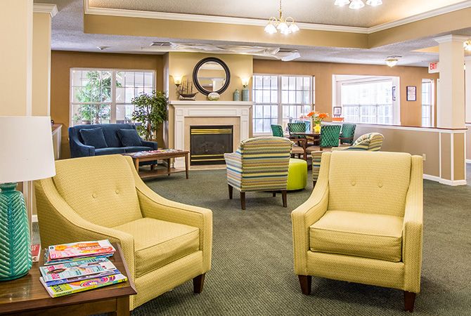 A cozy living room with comfortable seating and a fireplace.