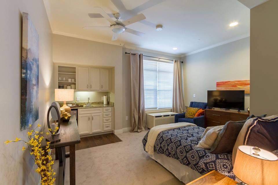 A modern bedroom with stylish decor and comfortable furniture.
