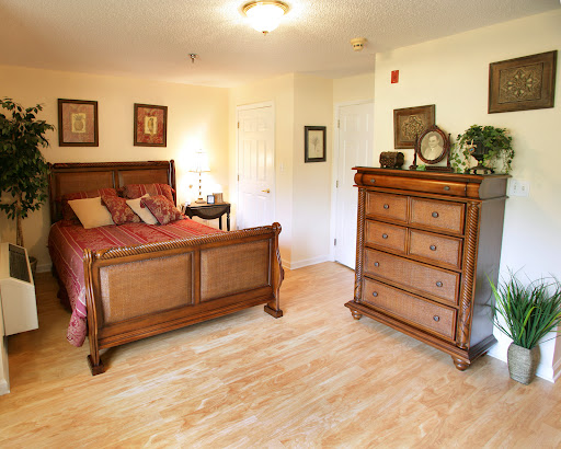 Cozy and elegantly designed bedroom featuring a wooden bed and dresser.