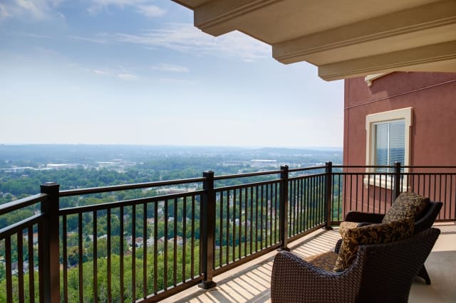 A scenic view from a balcony overlooking a vast landscape.