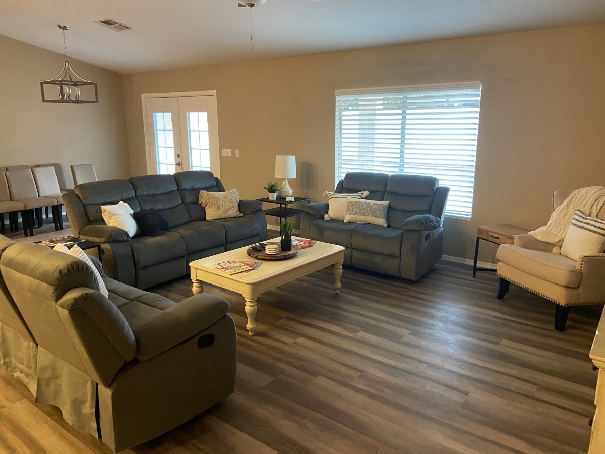 A cozy living room with sofas and a coffee table.