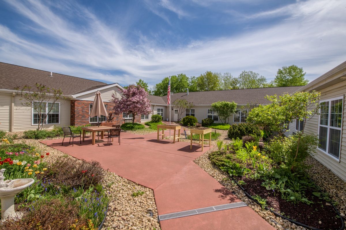 A serene courtyard with a landscaped garden and seating areas.