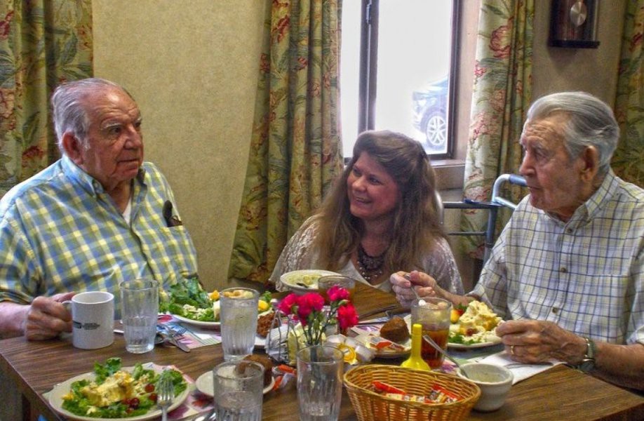 A group of people enjoying a meal together indoors.