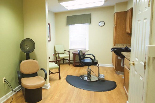 An interior of a hair salon featuring styling chairs and salon equipment.