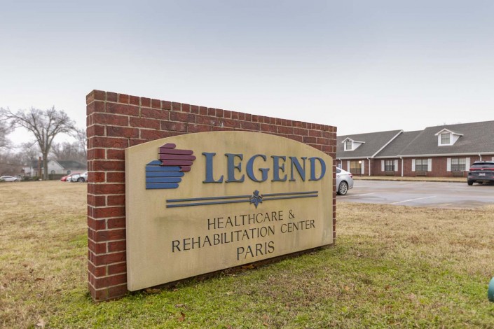 Sign for Legend Healthcare & Rehabilitation Center in front of a brick building.