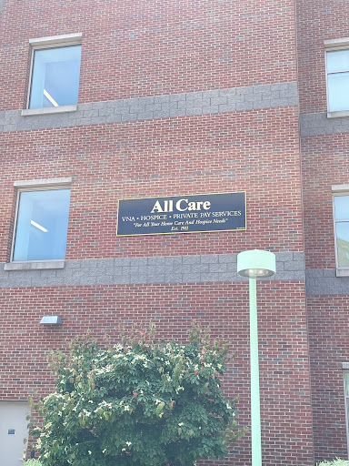 A building displaying a sign that reads 'All Care'.