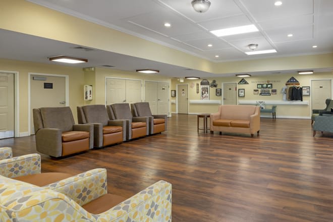 A spacious waiting area featuring comfortable seating and modern interior design.