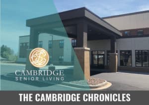 Front view of Cambridge Senior Living building with 'The Cambridge Chronicle' text overlay.