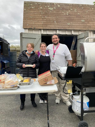 Volunteers gather to serve food at a community event.