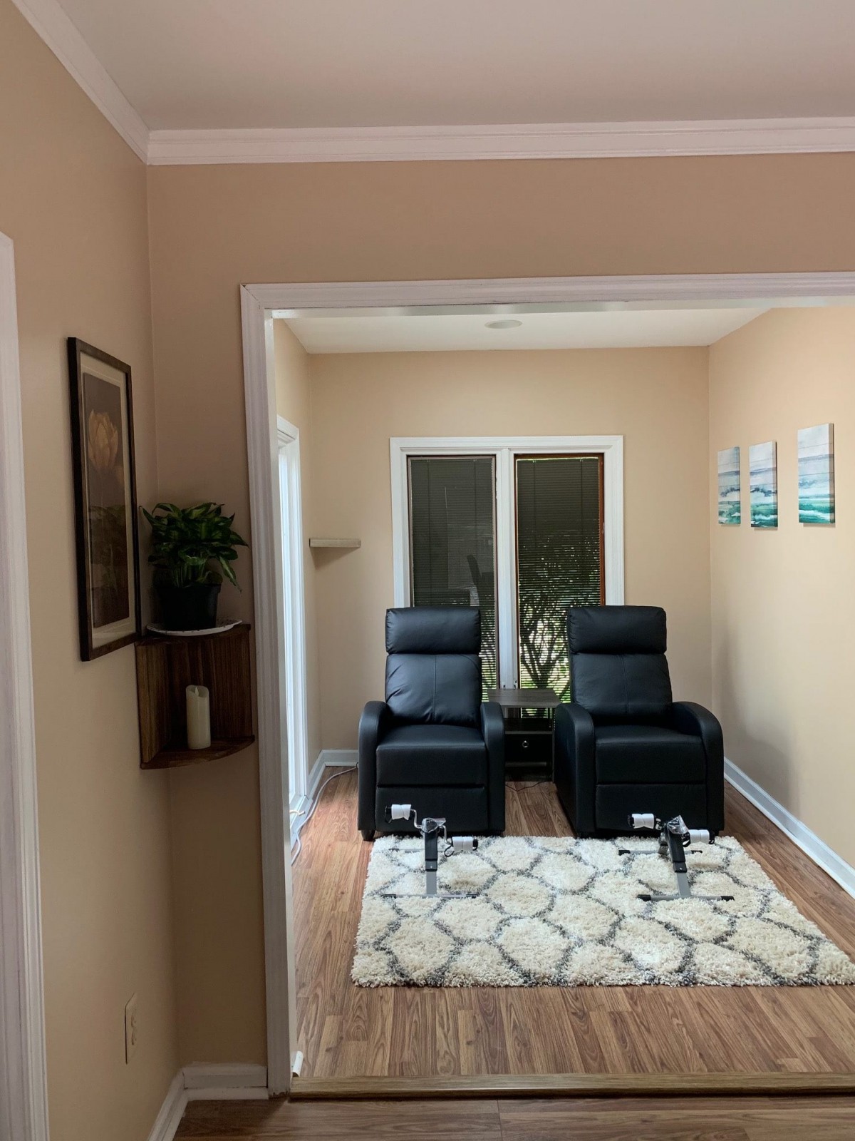 A cozy living room with two recliner chairs and elegant decor.