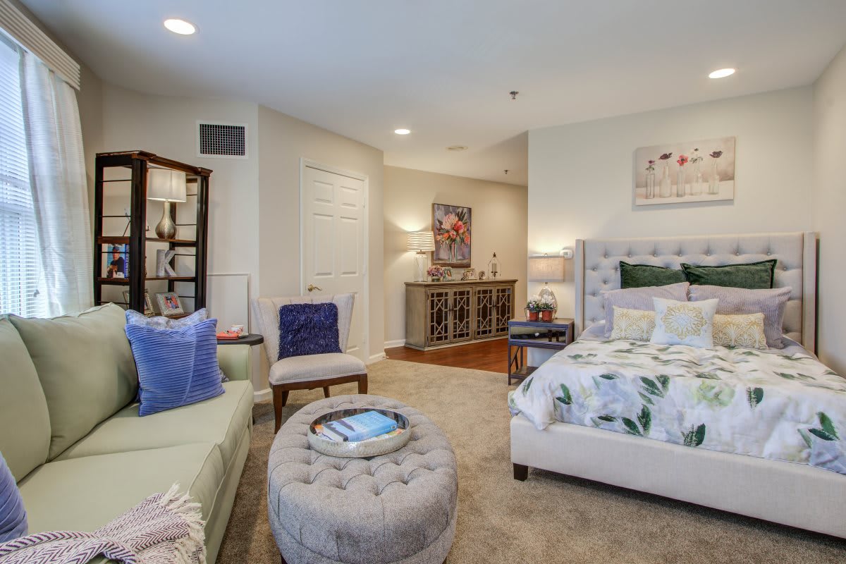 A cozy and modern bedroom featuring stylish furniture and decor.