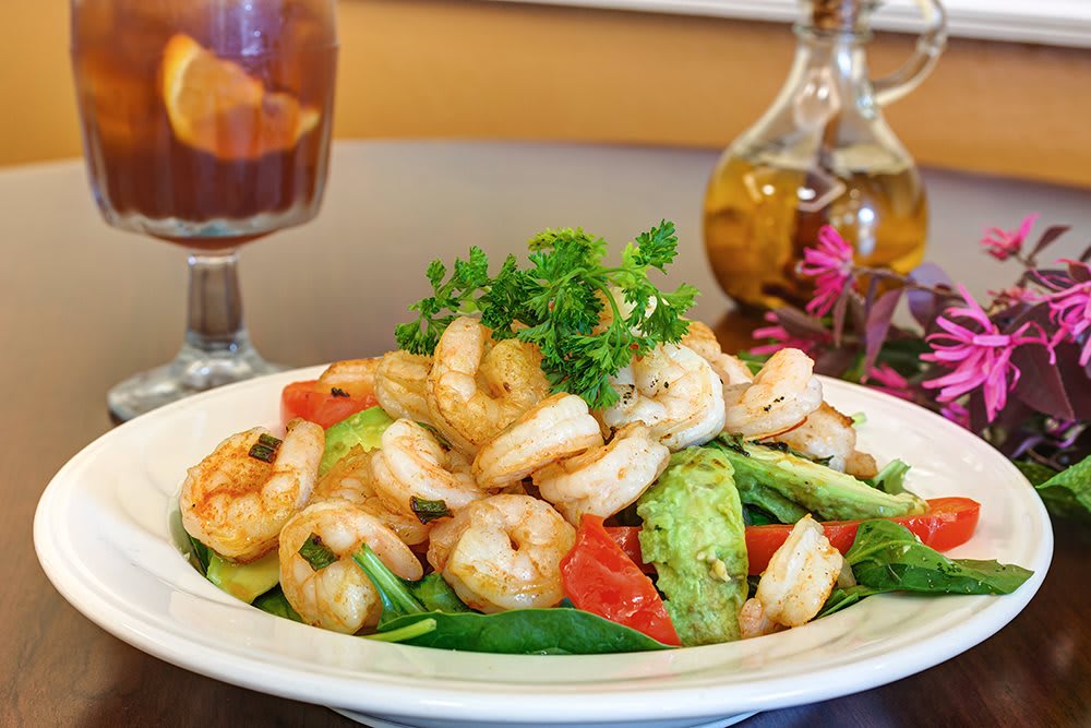 Fresh shrimp salad with avocado and vegetables.