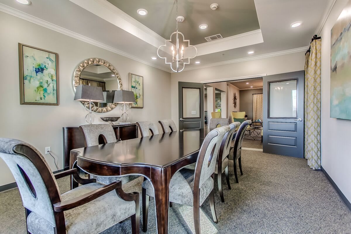 A well-designed dining room with elegant furniture and contemporary lighting.