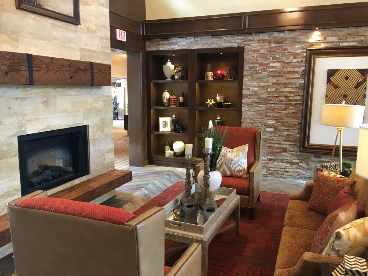 A cozy living room with a fireplace and elegant decor.
