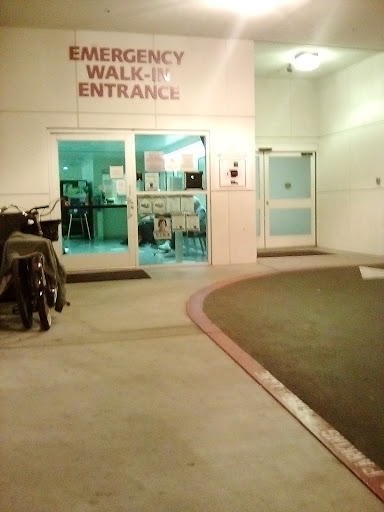 Walk-up entrance to a building, illuminated at night.