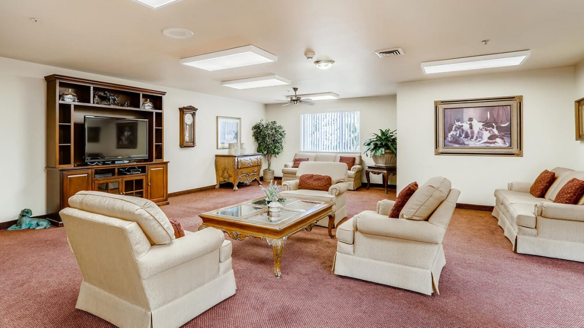 A cozy living room with comfortable seating and elegant decor.