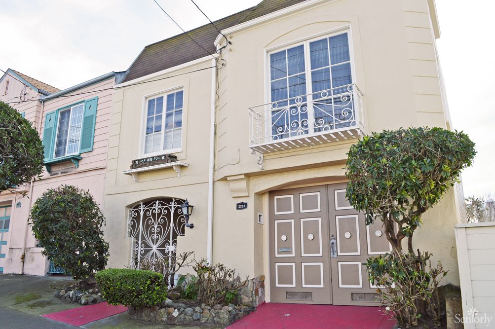 A residential house with a classic architectural design and well-maintained garden.