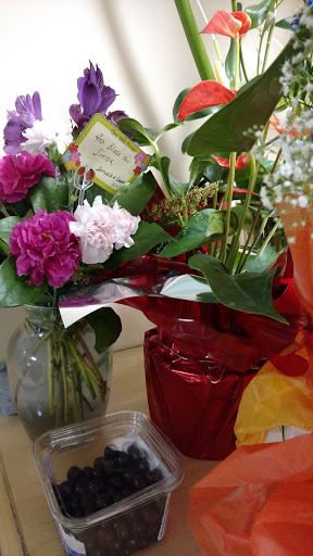 A vibrant display of flowers in decorative vases, perfect for any occasion.