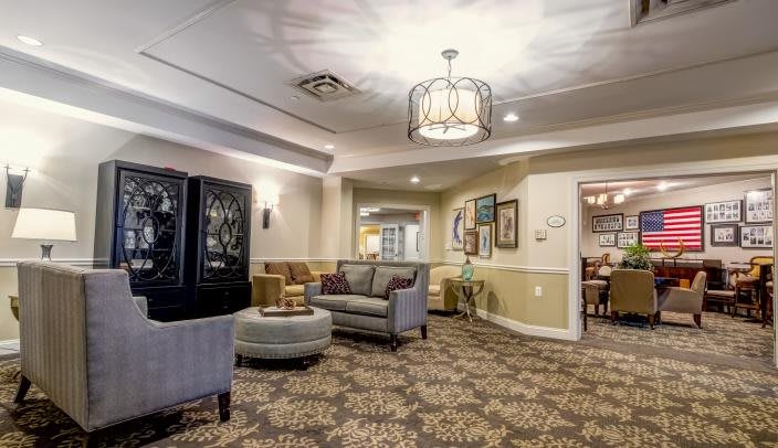 A cozy lounge area with comfortable seating and elegant lighting.