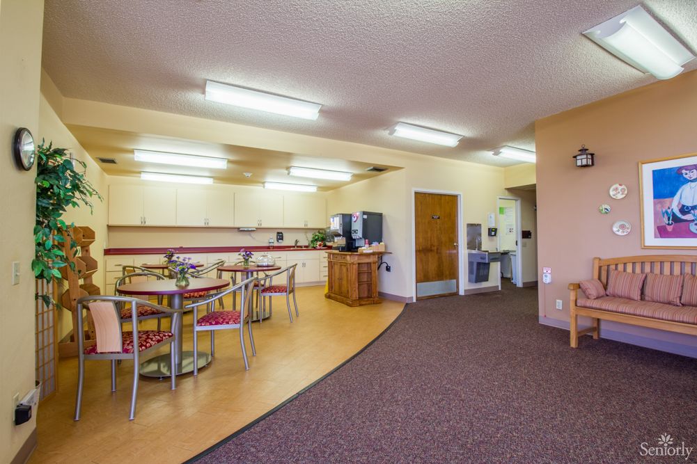 A spacious kitchen and dining area with modern appliances and ample seating.