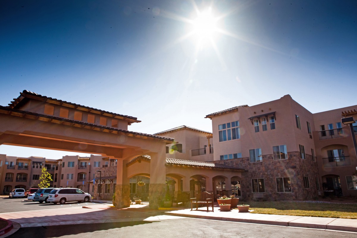 A sunny day at the entrance of a large residential building.