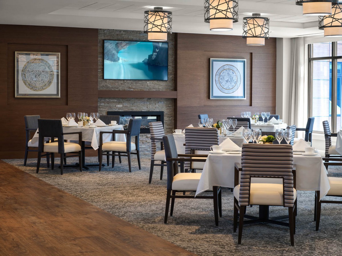 A modern and elegant dining room with neatly arranged tables and stylish decor.