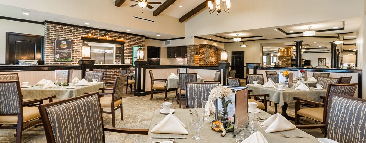 An elegant restaurant dining area with stylish decor and neatly arranged tables and chairs.