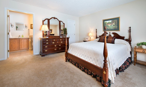 A beautifully arranged classic-style bedroom with elegant furniture and a cozy atmosphere.