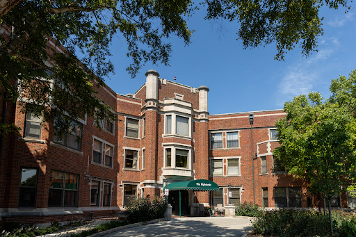 A beautifully designed historical brick building with a welcoming entrance.