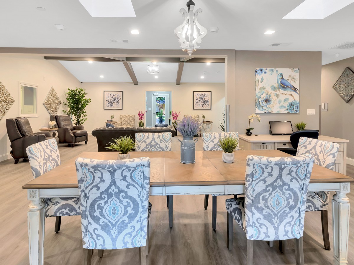 A beautifully designed open-concept living and dining area with elegant furnishings and decor.