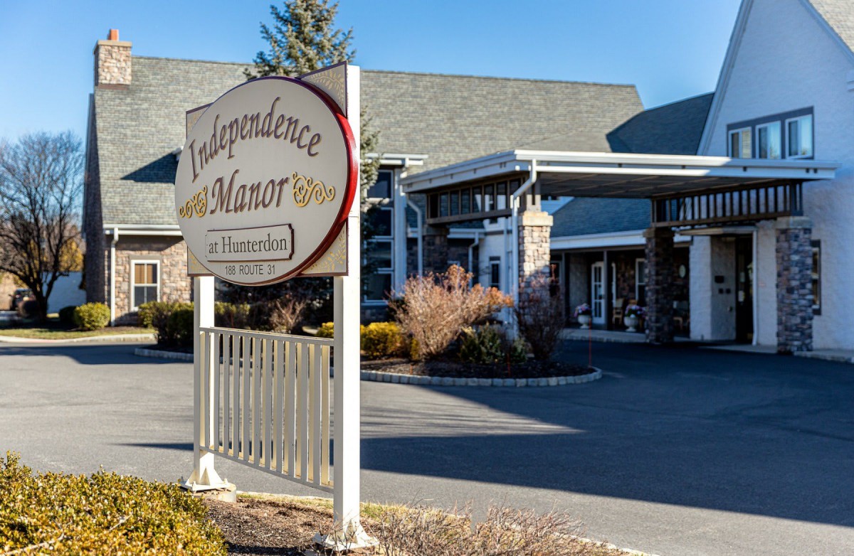 Front entrance of Villageresca Manor with distinctive signage.