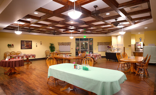 A cozy dining area featuring wooden accents and a green tablecloth, perfect for gatherings.