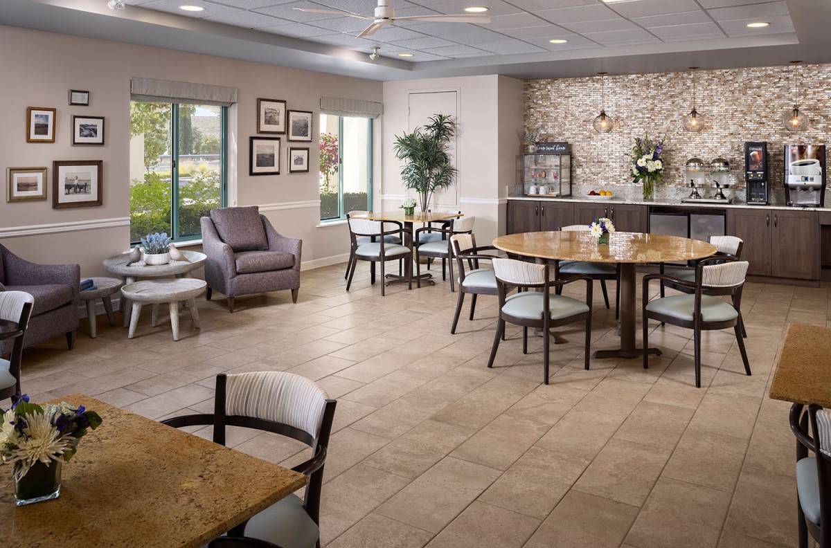 A modern dining area with sleek furniture and a cozy ambiance.