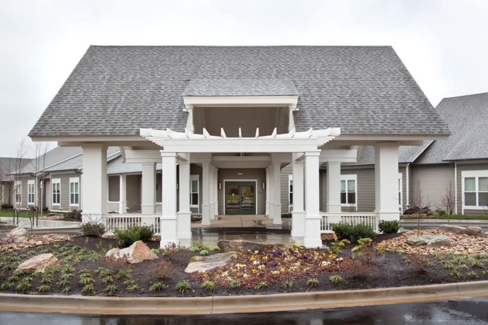 Elegant house with a welcoming entryway and landscaped garden.