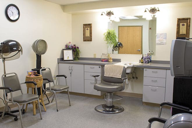A hair salon interior with styling chairs and mirrors.