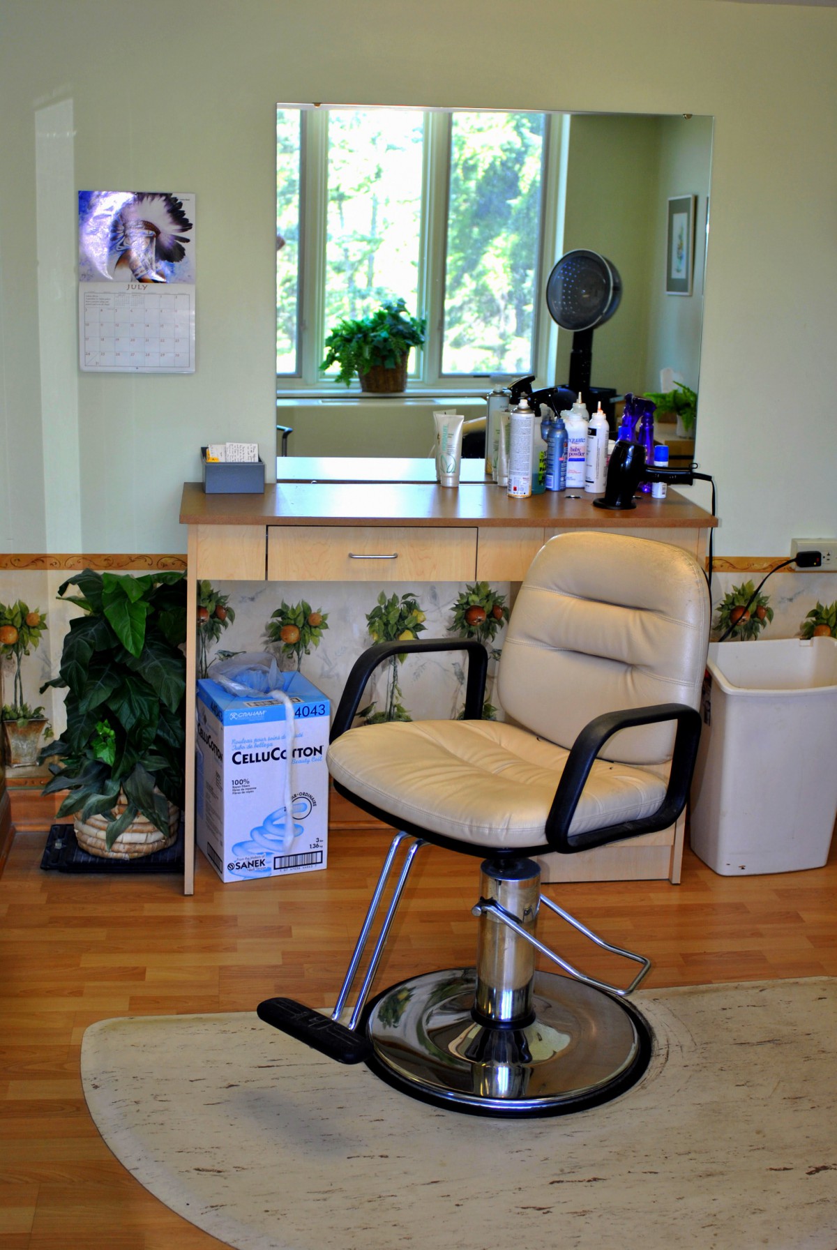 A hair salon interior featuring a comfortable styling chair, mirror, and various hair products.
