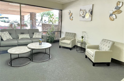 A modern and inviting living room space with comfortable seating and natural light.