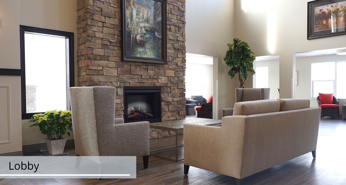 Cozy living room with a stone fireplace and comfortable armchairs.