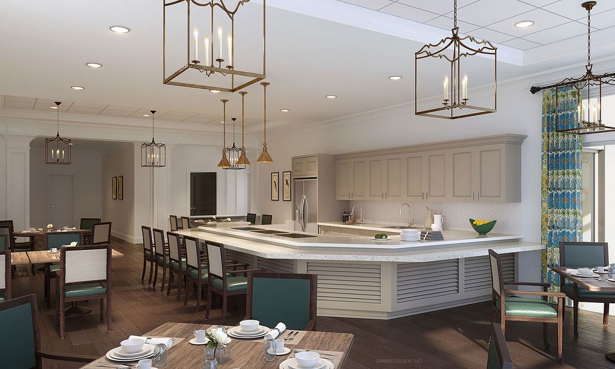 A modern kitchen with a large island, surrounded by bar stools and illuminated by pendant lighting.